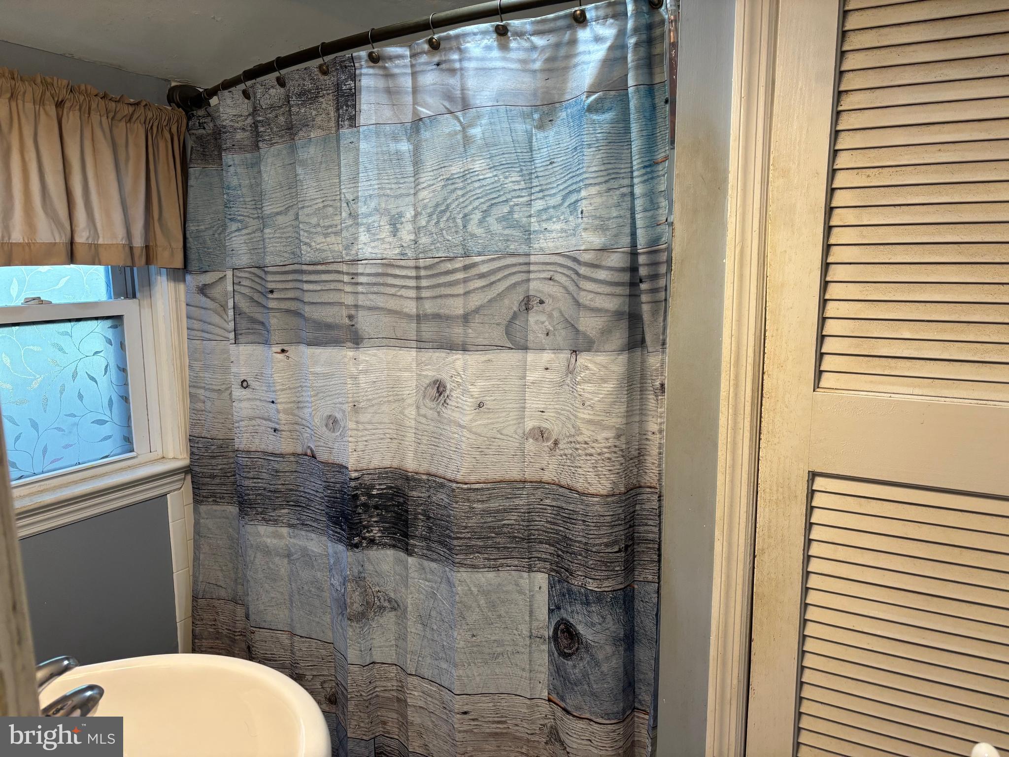 70 Main Street Waretown, NJ 08758 - Photo 47 of 54 a bathroom with a shower and toilet