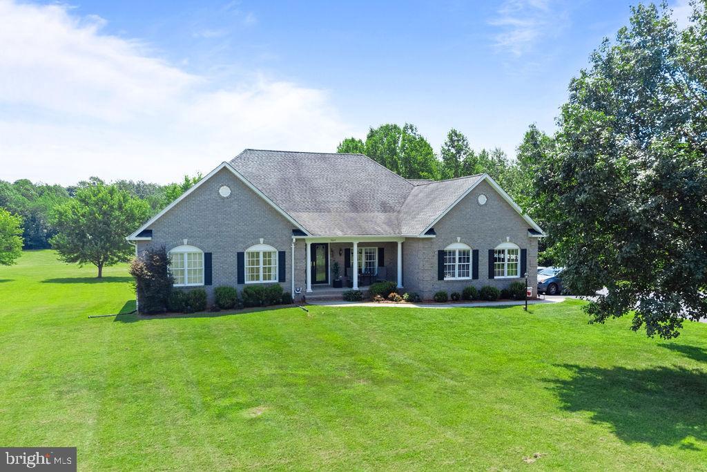 7609 Baileys Road Spotsylvania, VA 22551 - Photo 107 of 111 a view of a house with a big yard and potted plants in front of a house