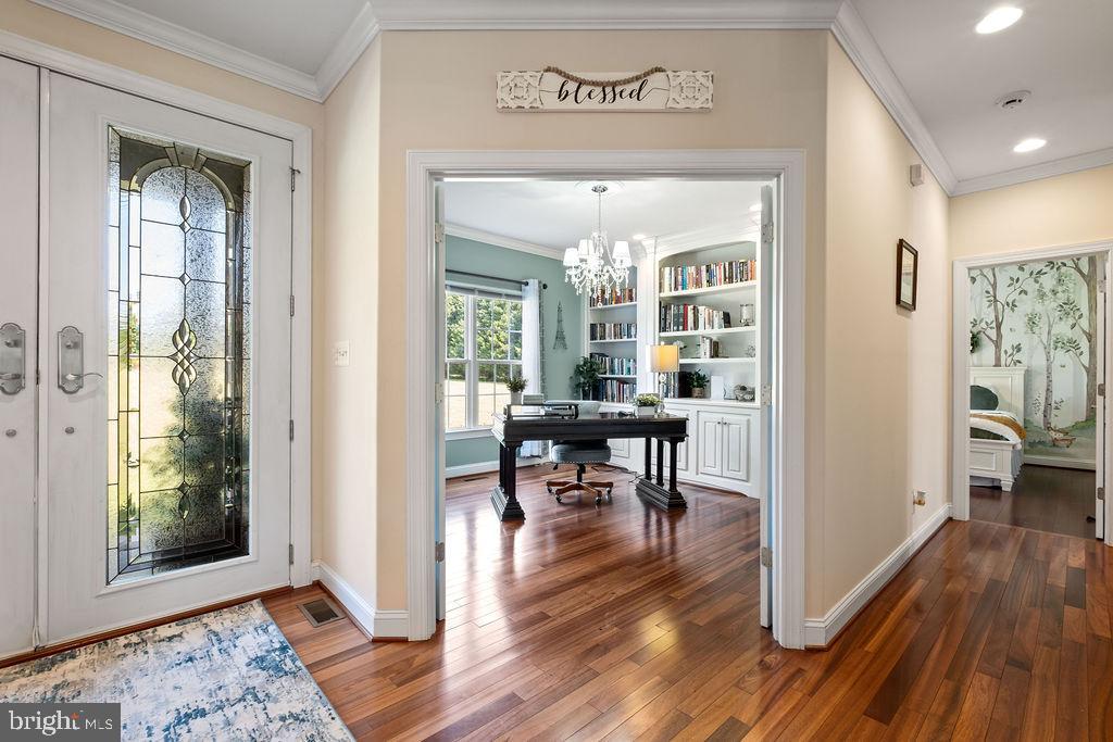 7609 Baileys Road Spotsylvania, VA 22551 - Photo 12 of 111 a view of a livingroom kitchen and dining room with wooden floor