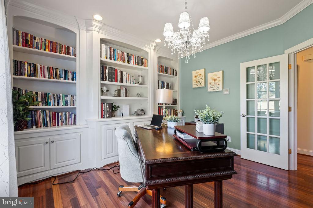 7609 Baileys Road Spotsylvania, VA 22551 - Photo 13 of 111 a view of a workspace with furniture and a bookshelf