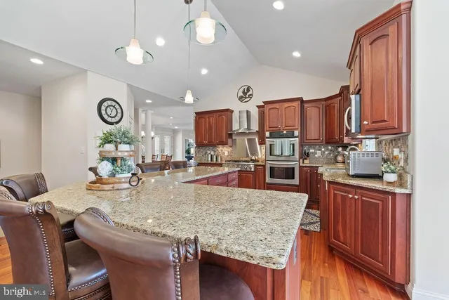 a spacious bedroom with a bed and a flat screen tv