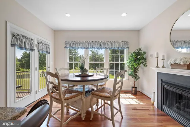 a bed room with a bed a flat tv screen and a dresser