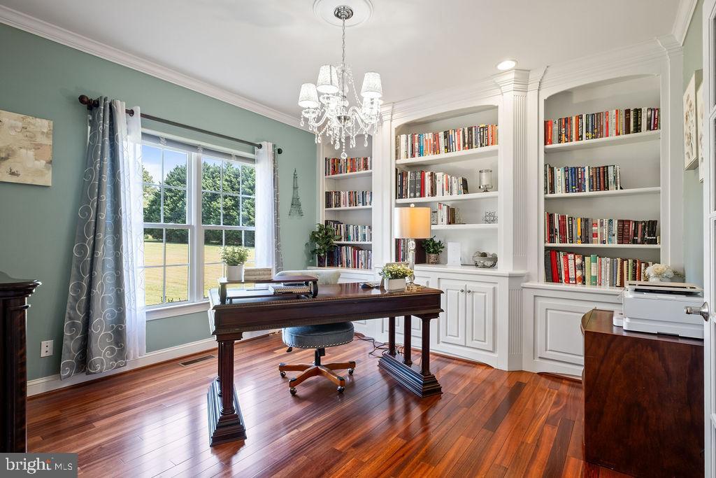 7609 Baileys Road Spotsylvania, VA 22551 - Photo 30 of 111 a view of a workspace with furniture window and wooden floor