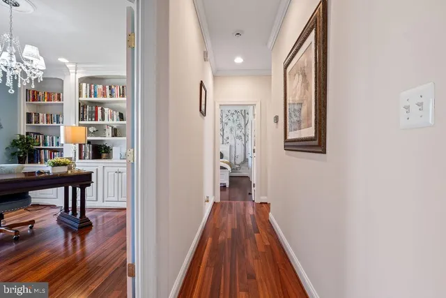 a bathroom with a granite countertop sink and a large mirror