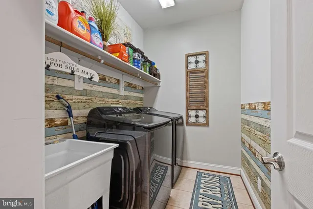 a bathroom with a granite countertop sink a mirror and a vanity
