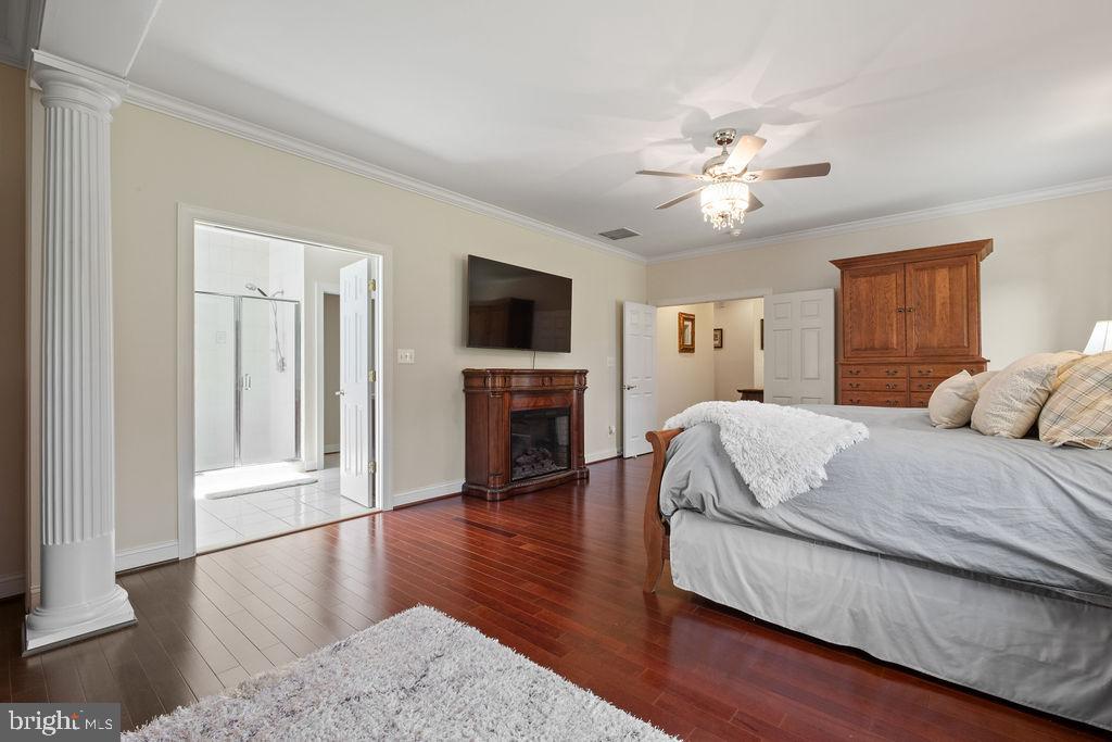 7609 Baileys Road Spotsylvania, VA 22551 - Photo 35 of 111 a spacious bedroom with a bed and a flat screen tv