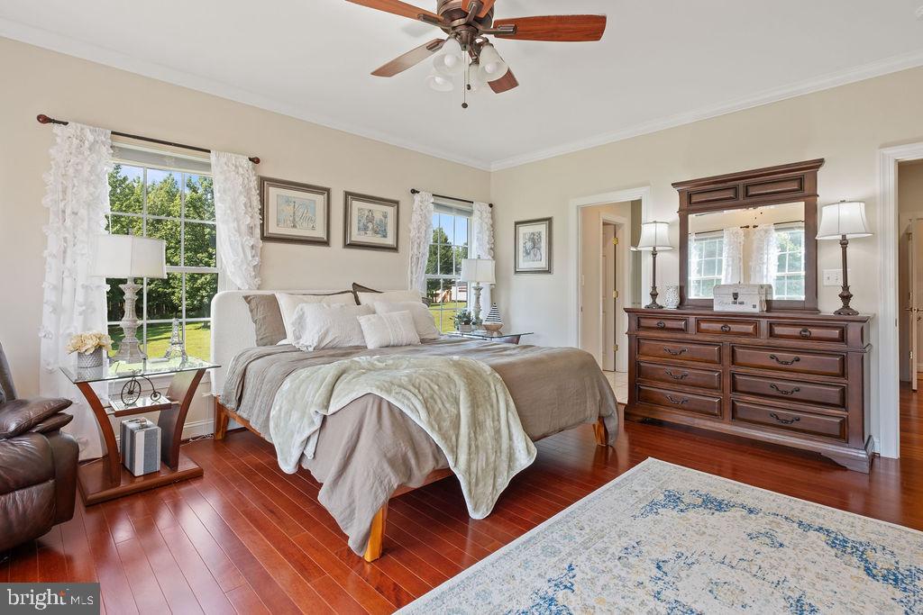 7609 Baileys Road Spotsylvania, VA 22551 - Photo 36 of 111 a bedroom with a bed and wooden floor