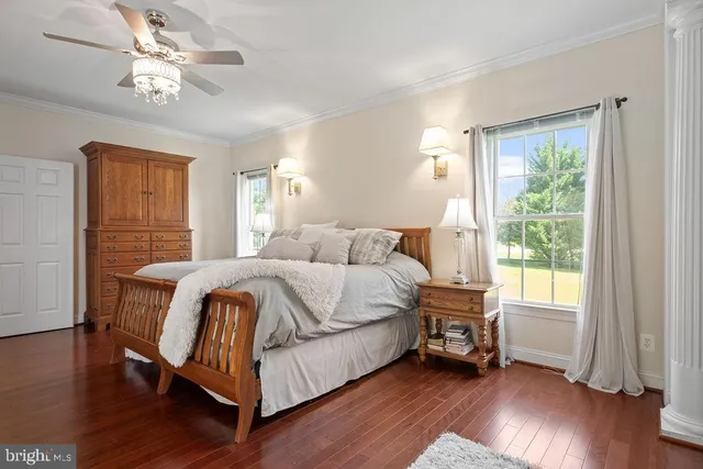 a view of a livingroom with workspace and a window