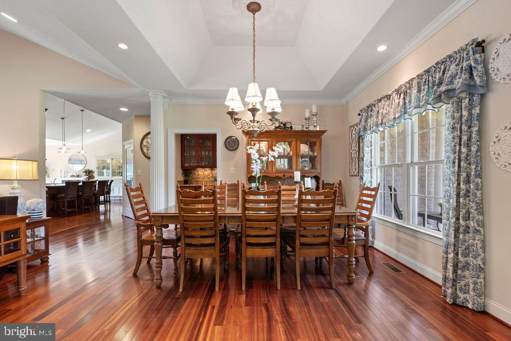 7609 Baileys Road Spotsylvania, VA 22551 - Photo 7 of 111 a view of a dining room with furniture window and wooden floor