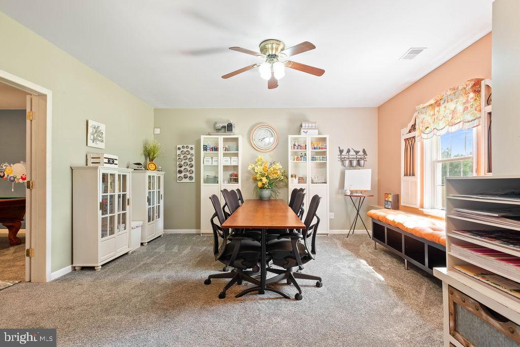 7609 Baileys Road Spotsylvania, VA 22551 - Photo 71 of 111 a view of a workspace with furniture and a window