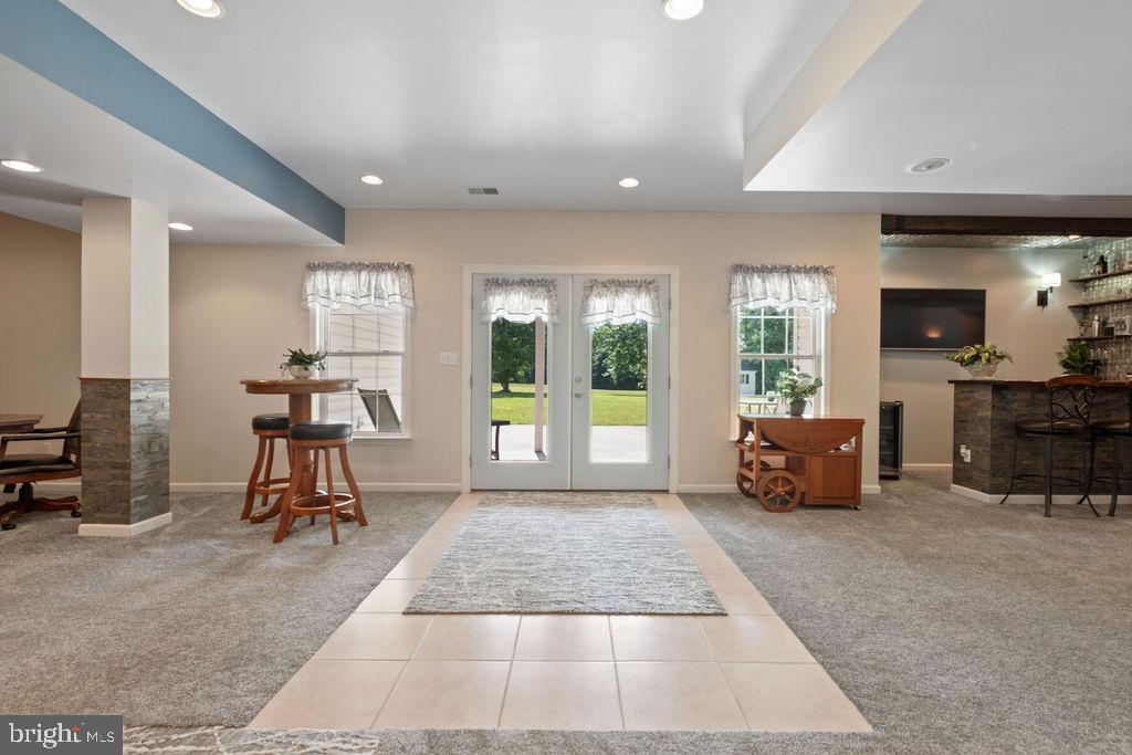 7609 Baileys Road Spotsylvania, VA 22551 - Photo 81 of 111 a living room with furniture and a floor to ceiling window