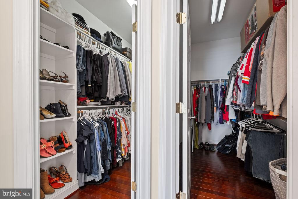 7609 Baileys Road Spotsylvania, VA 22551 - Photo 95 of 111 a view of walk in closet with clothes and shoes