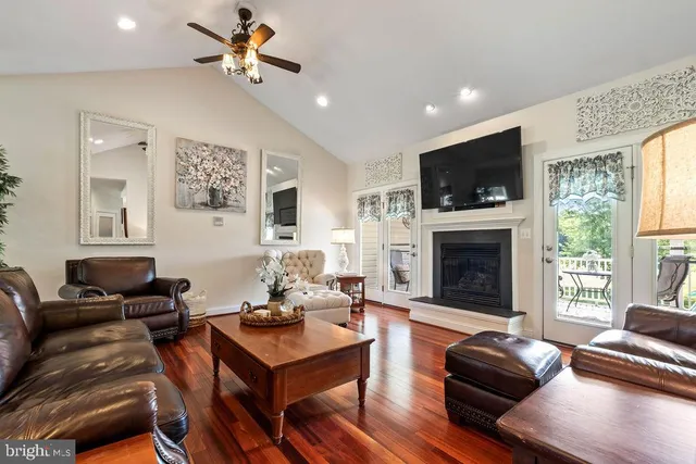 a view of a workspace with furniture and a bookshelf
