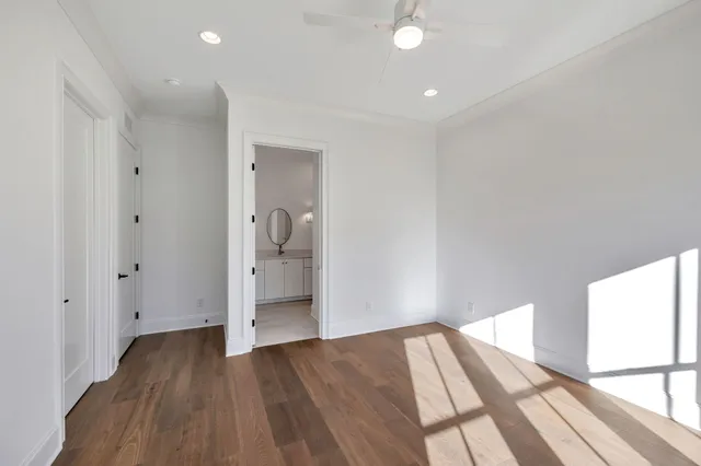 a view of wooden floor and windows in a room