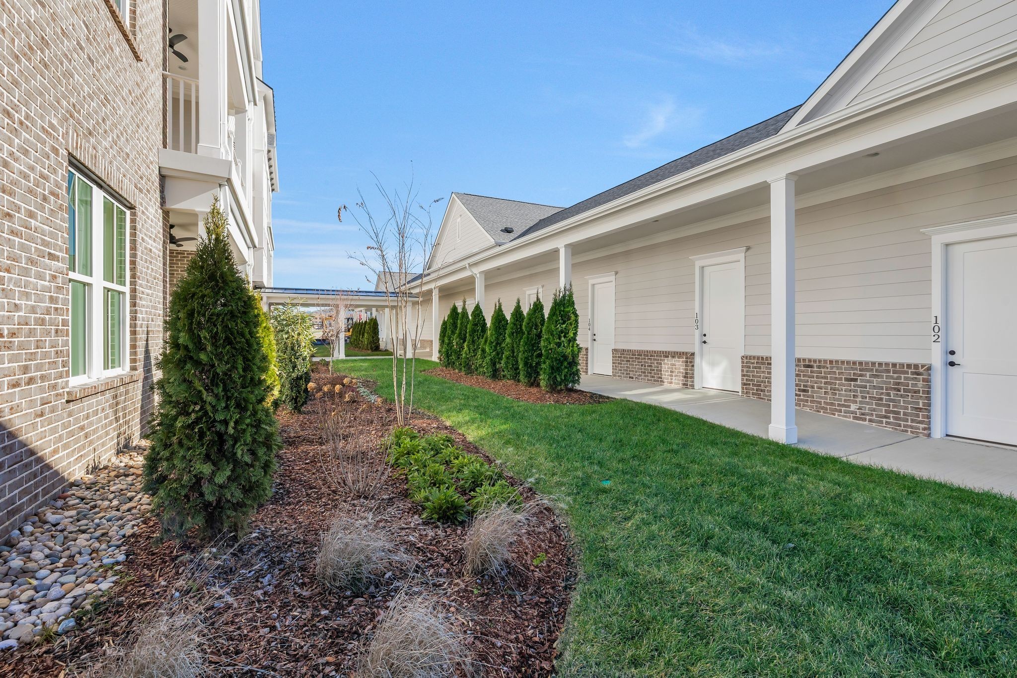 6037 Whitman Road, Unit 203 Franklin, TN 37064 - Photo 44 of 52 a front view of a house with garden