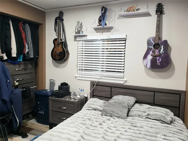 a bedroom with a bed and cabinets