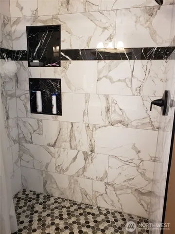 a stone house with a bench