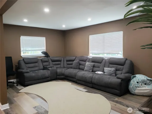 a living room with a couch and a window