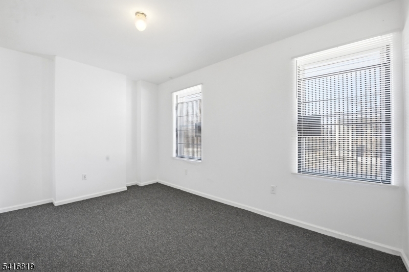 44 3rd Street Newark, NJ 07107 - Photo 6 of 12 an empty room with a window