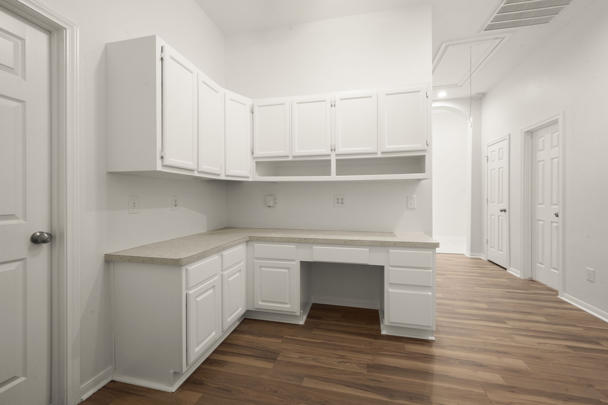 2018 Copperwood Park Lane Spring, TX 77386 - Photo 12 of 33 Cute computer nook or homework station with ample white cabinetry and a spacious countertop. Located between bedroom 2 and 3 offering functional storage and workspace potential.