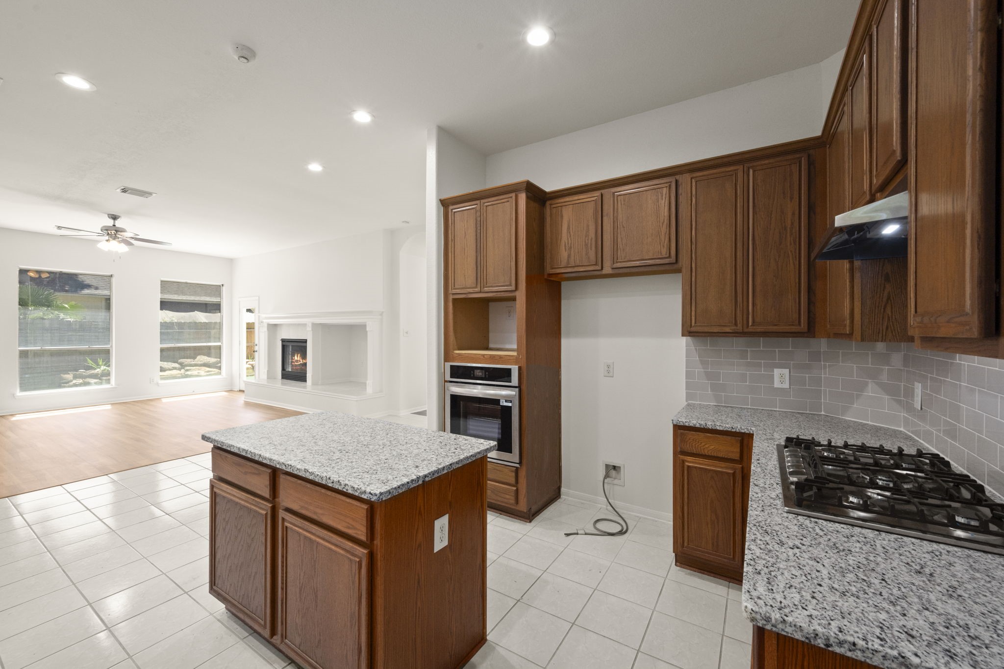 2018 Copperwood Park Lane Spring, TX 77386 - Photo 18 of 33 a kitchen with stainless steel appliances granite countertop a stove a sink and a refrigerator