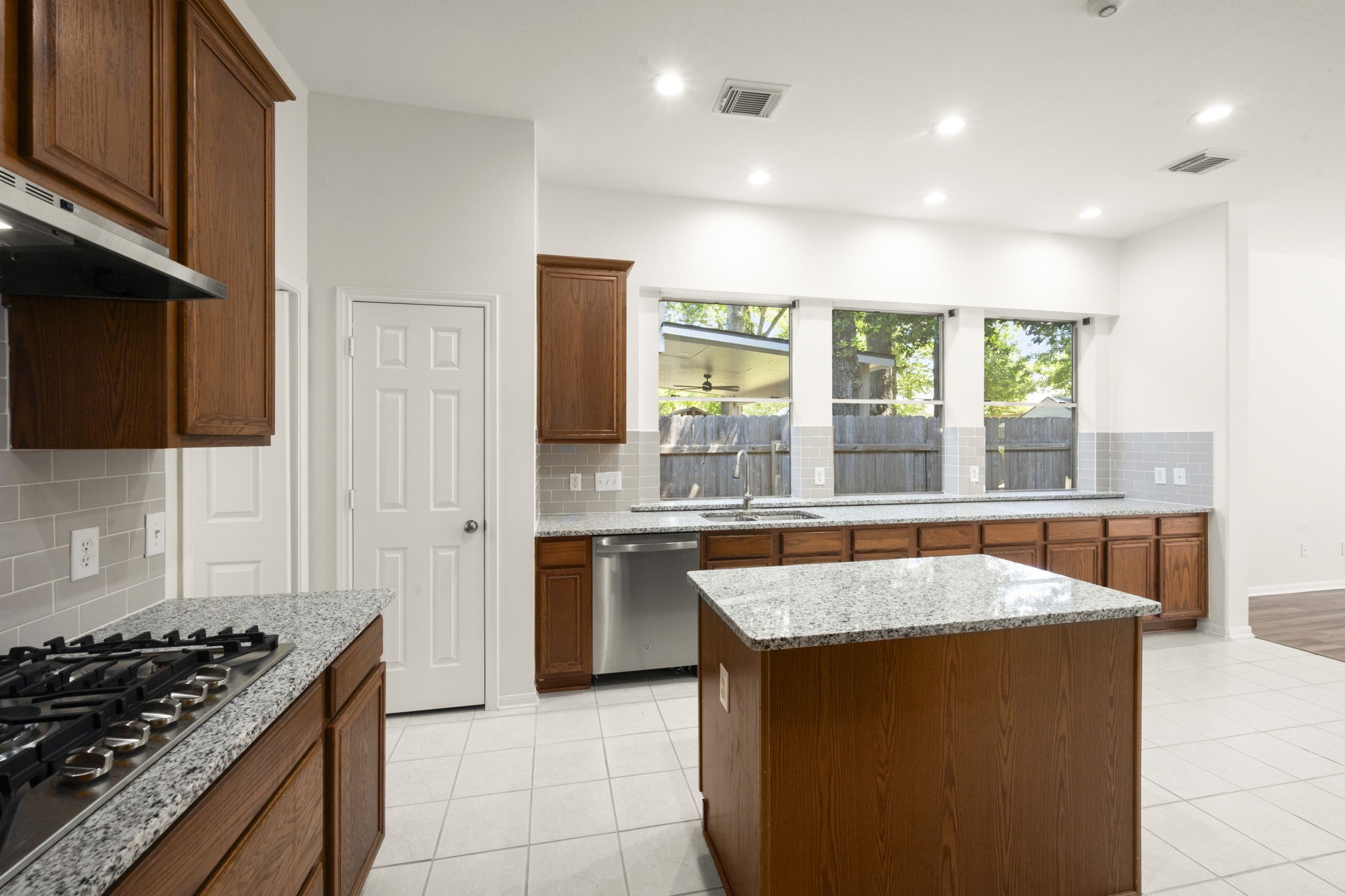 2018 Copperwood Park Lane Spring, TX 77386 - Photo 19 of 33 a kitchen with stainless steel appliances granite countertop a stove and a sink