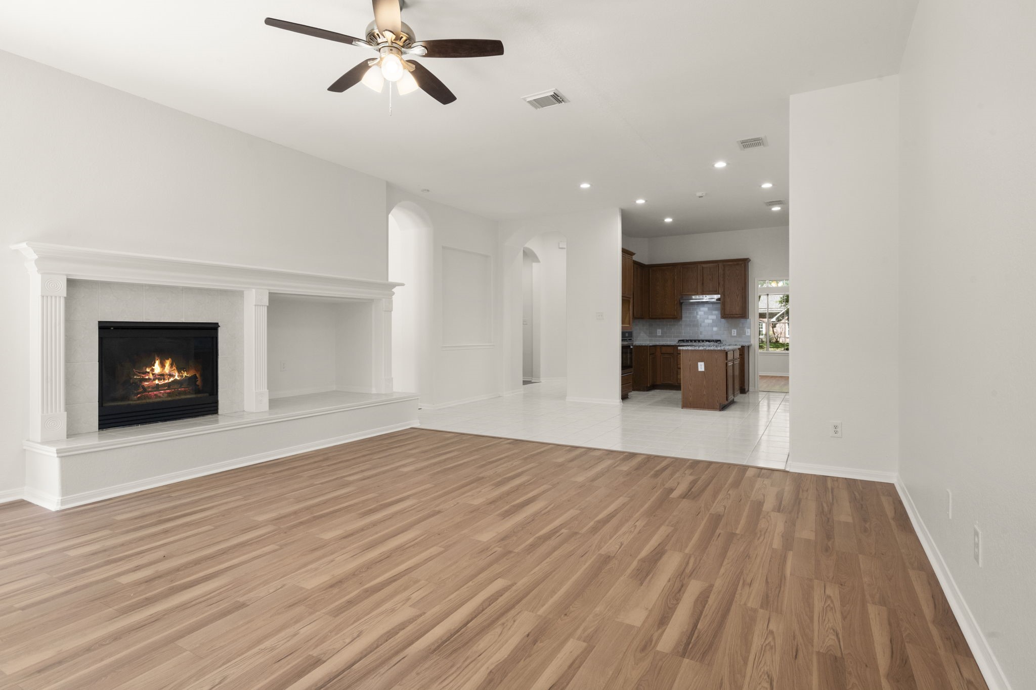 2018 Copperwood Park Lane Spring, TX 77386 - Photo 22 of 33 a view of empty room with wooden floor and fireplace
