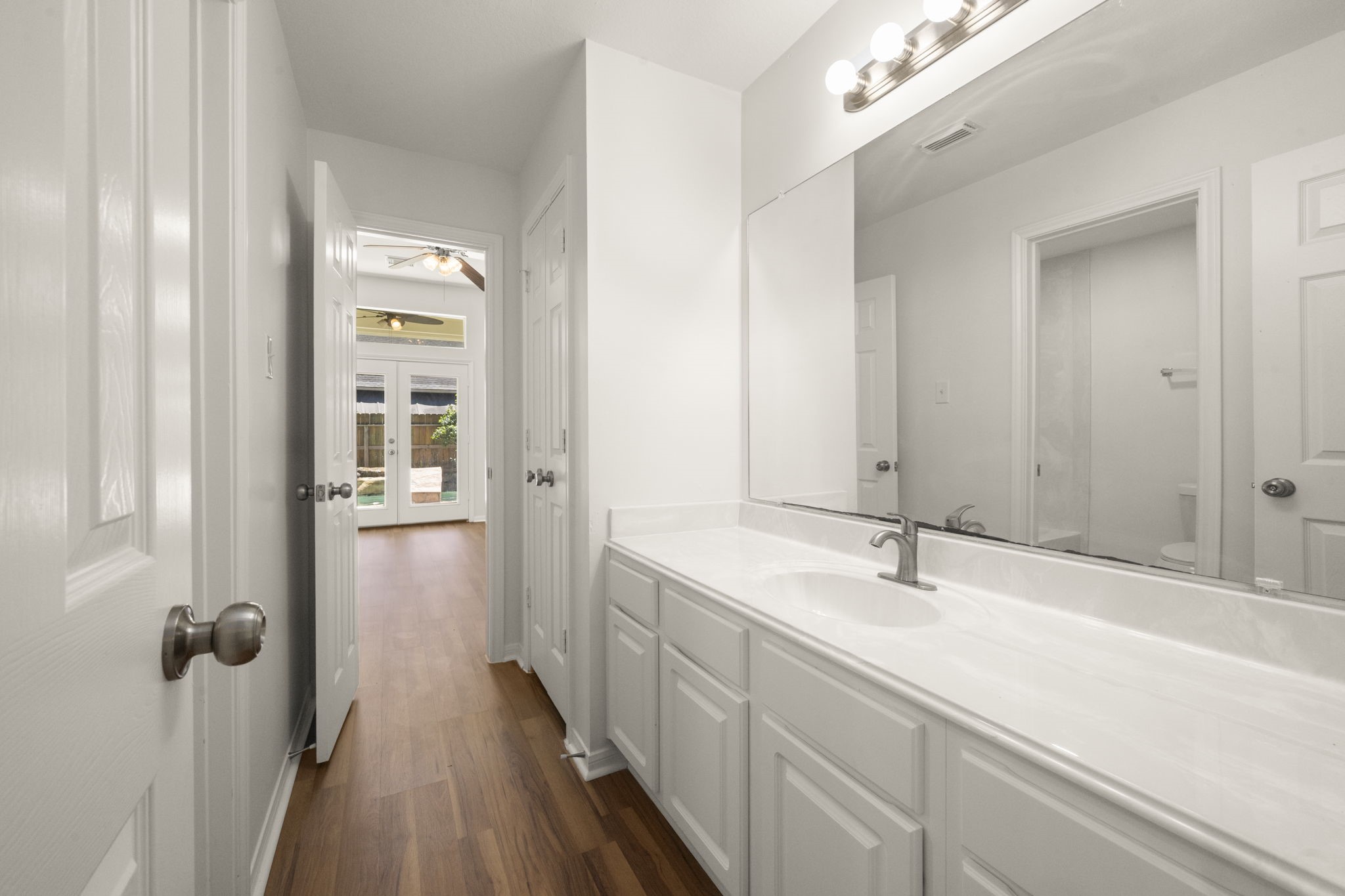 2018 Copperwood Park Lane Spring, TX 77386 - Photo 26 of 33 a bathroom with a sink and mirror with shower