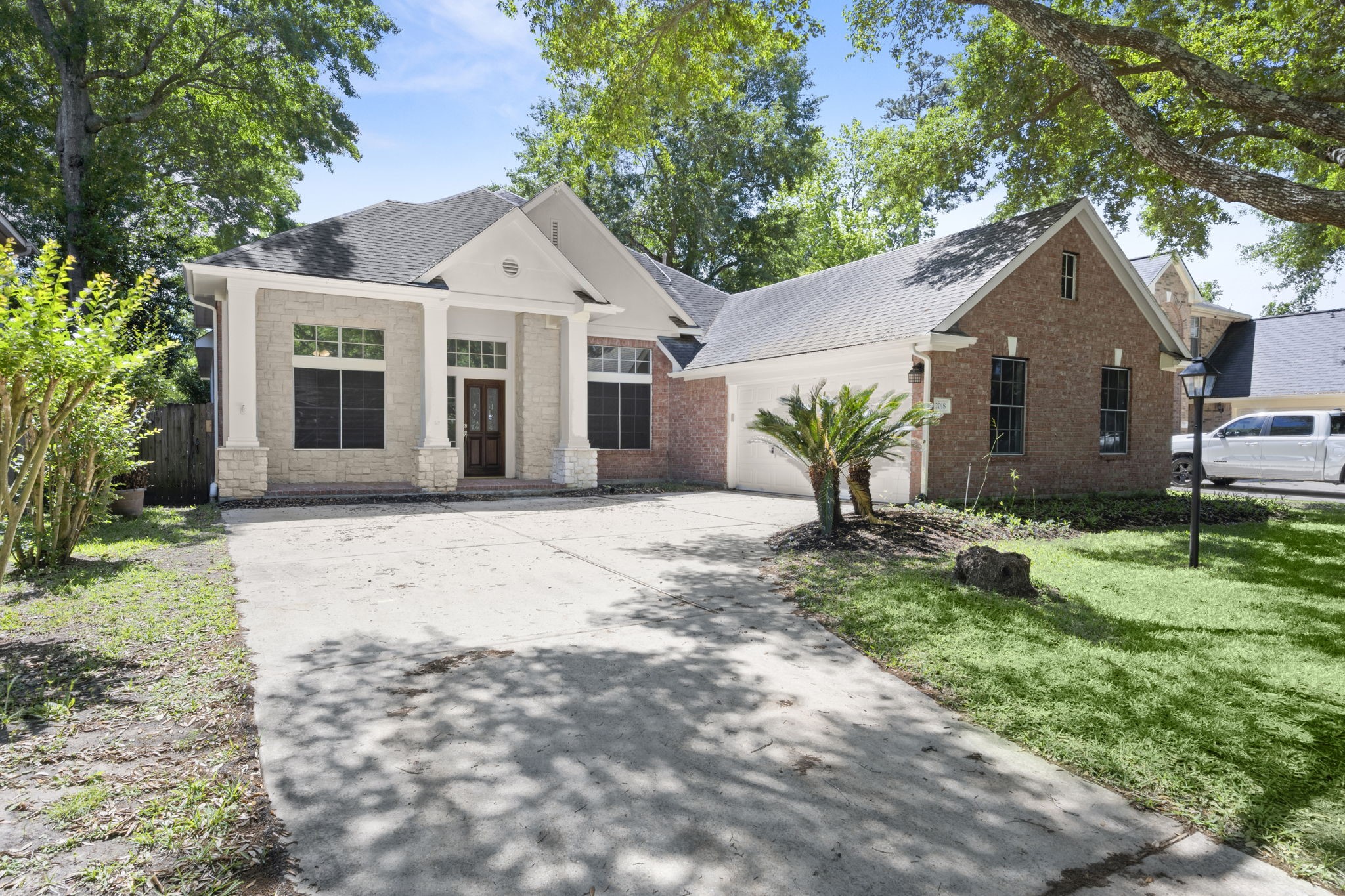 2018 Copperwood Park Lane Spring, TX 77386 - Photo 3 of 33 a front view of a house with garden