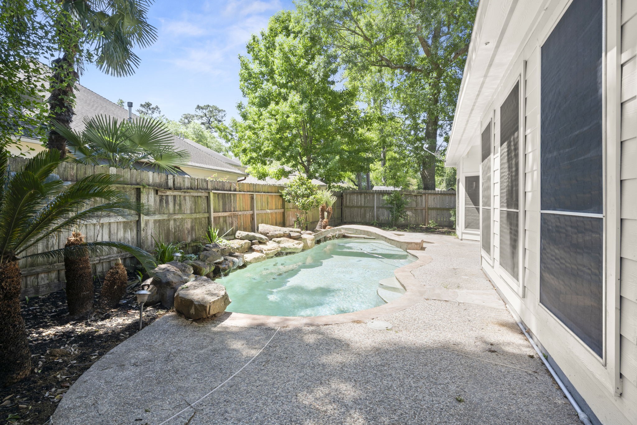 2018 Copperwood Park Lane Spring, TX 77386 - Photo 4 of 33 a view of a backyard with sitting area and furniture
