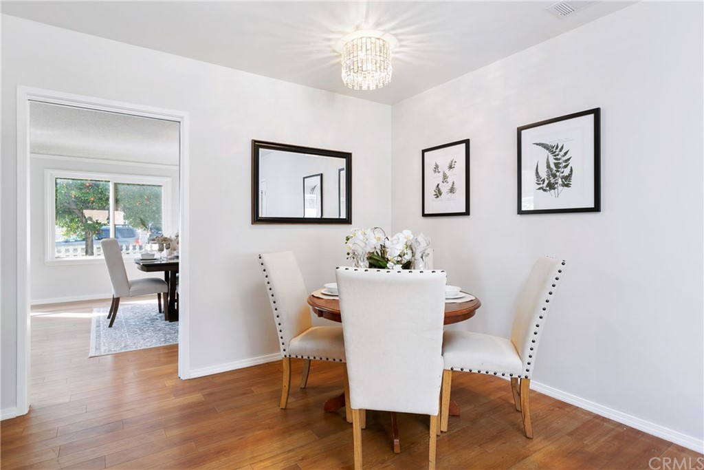 3605 East Del Mar Boulevard Pasadena, CA 91107 - Photo 12 of 22 a view of a dining room with furniture and wooden floor