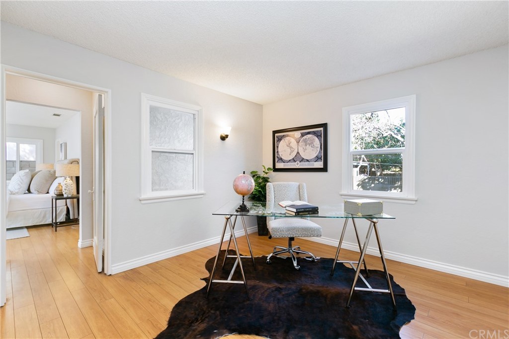 3605 East Del Mar Boulevard Pasadena, CA 91107 - Photo 14 of 22 a living room with furniture a wooden floor and a table