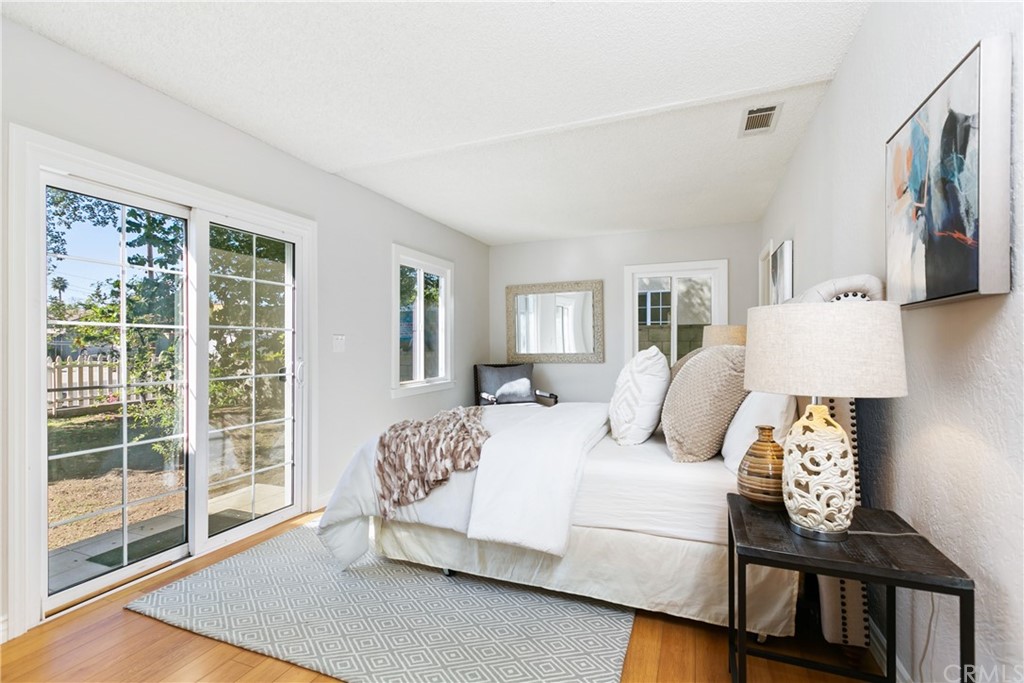 3605 East Del Mar Boulevard Pasadena, CA 91107 - Photo 15 of 22 a bedroom with a bed and wooden floor