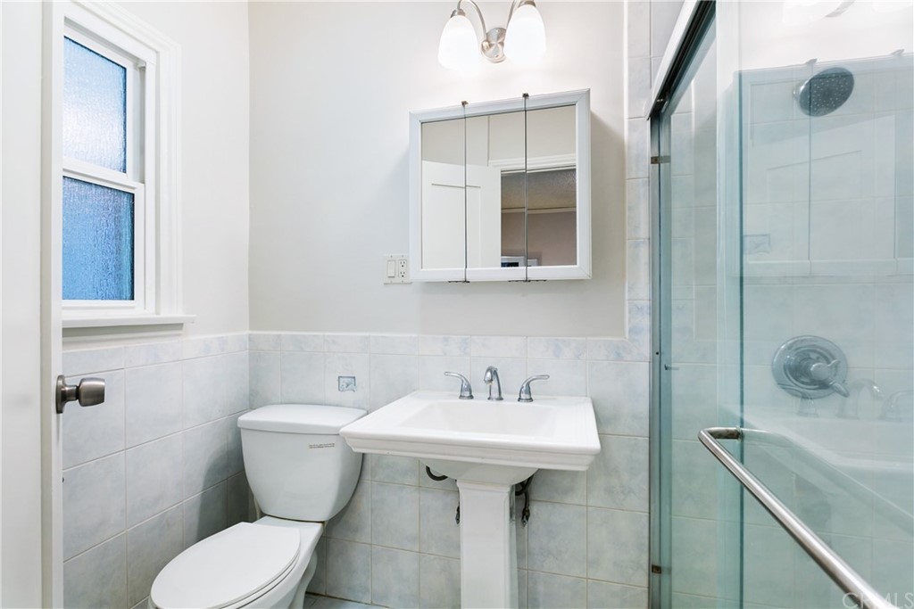 3605 East Del Mar Boulevard Pasadena, CA 91107 - Photo 22 of 22 a bathroom with a sink toilet and shower