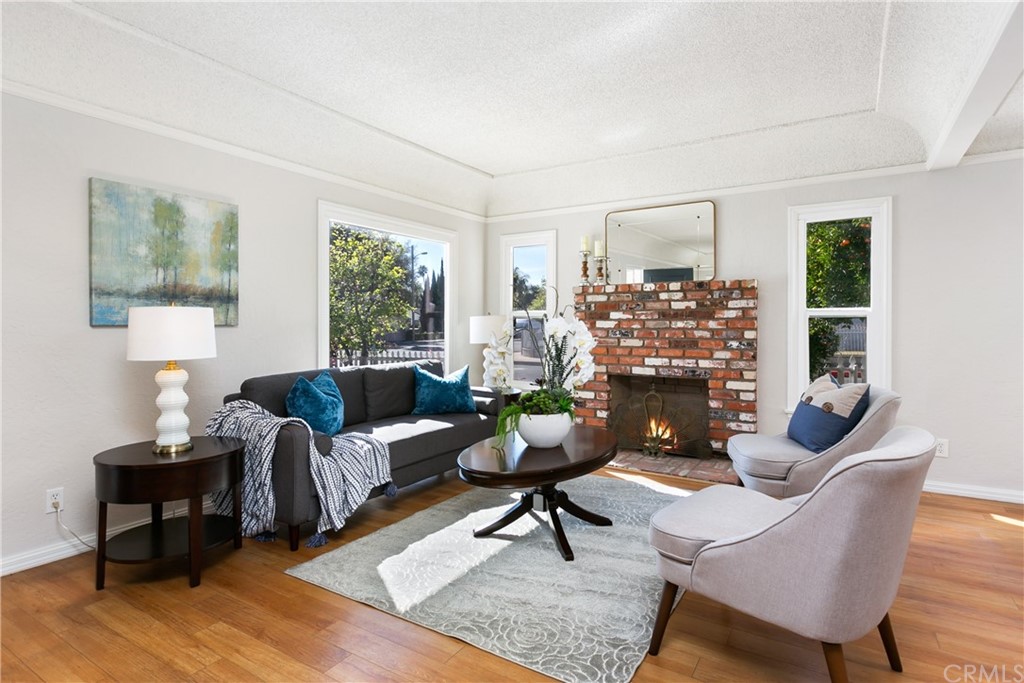 3605 East Del Mar Boulevard Pasadena, CA 91107 - Photo 3 of 22 a living room with furniture and a window