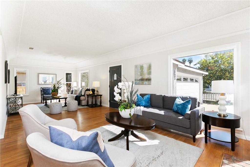 3605 East Del Mar Boulevard Pasadena, CA 91107 - Photo 4 of 22 a living room with furniture wooden floor and a large window