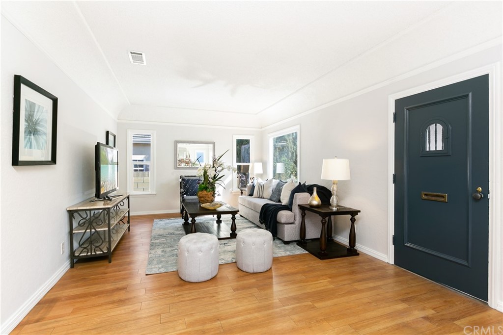 3605 East Del Mar Boulevard Pasadena, CA 91107 - Photo 5 of 22 a living room with furniture and wooden floor