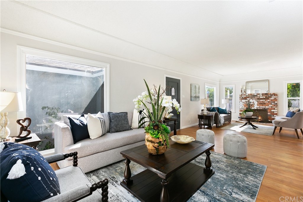 3605 East Del Mar Boulevard Pasadena, CA 91107 - Photo 7 of 22 a living room with furniture potted plant and a window