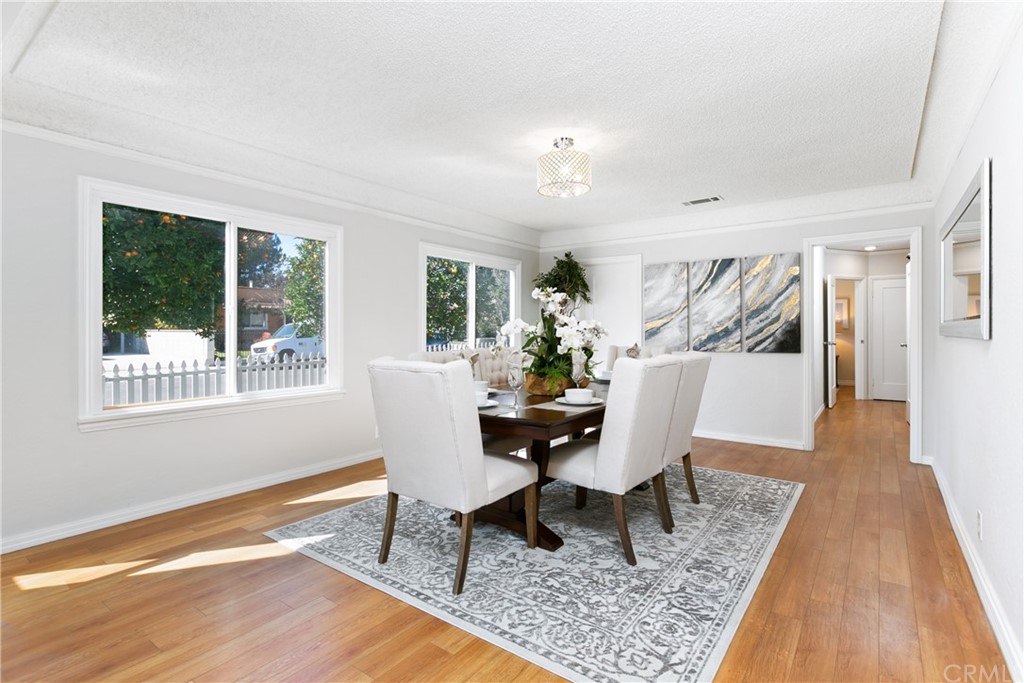 3605 East Del Mar Boulevard Pasadena, CA 91107 - Photo 8 of 22 a dining room with wooden floor and a rug