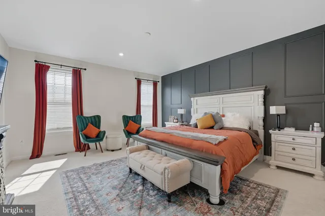 a bedroom with bed and window