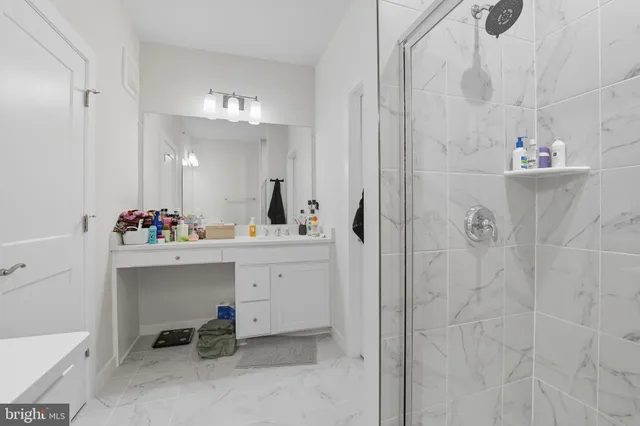 a bathroom with a sink double vanity and a mirror