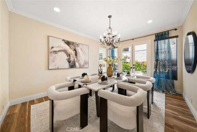 a very nice looking dining room with a table and chairs