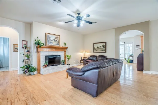 a living room with furniture and a fireplace