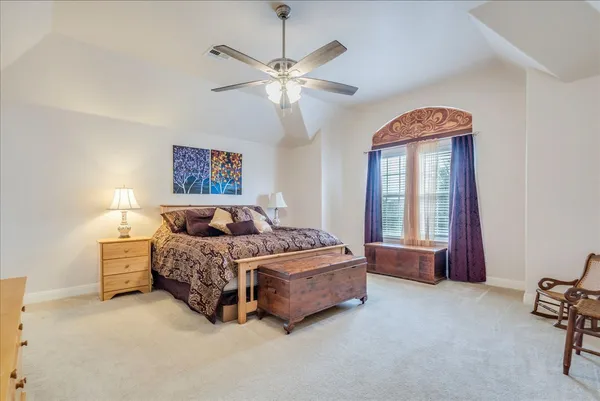 a view of a hallway with wooden floor and stairs