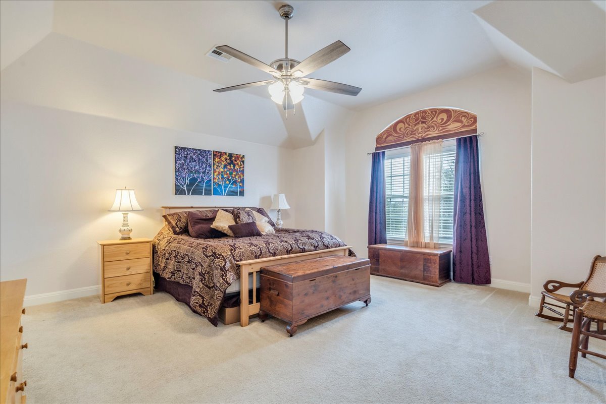 1077 Fairway Kyle, TX 78640 - Photo 24 of 40 a living room with a bed furniture and a window