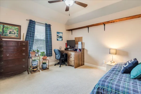 a bathroom with a bathtub sink and mirror