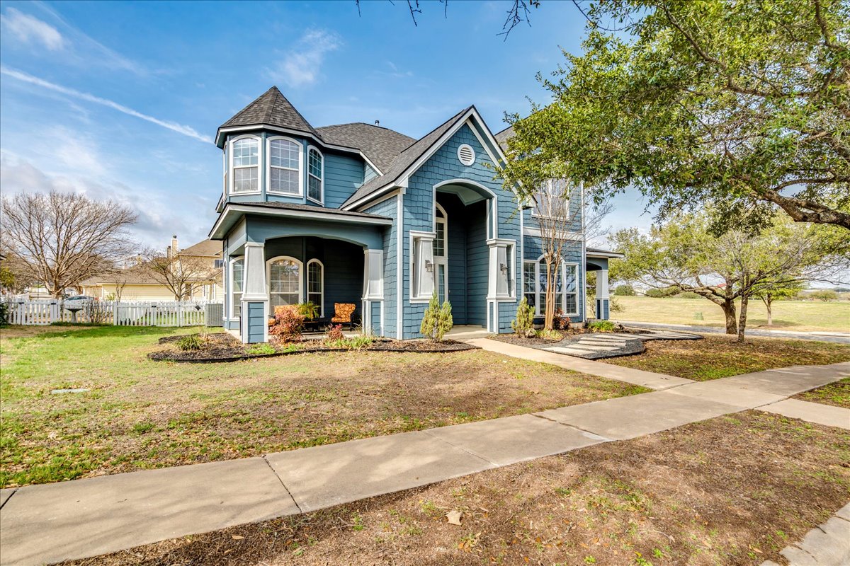 1077 Fairway Kyle, TX 78640 - Photo 3 of 40 a view of a house with garden and plants