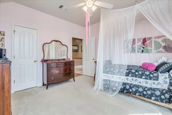 a living room with furniture cabinets and a window