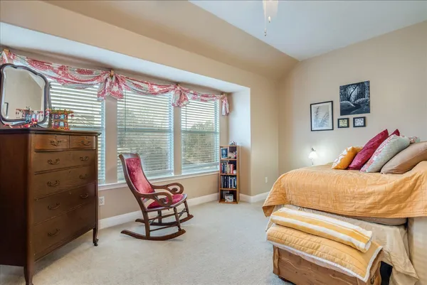a living room with furniture and a bed