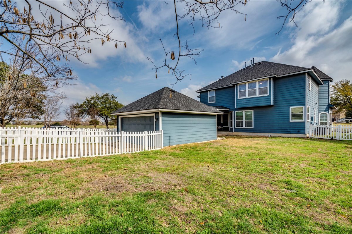 1077 Fairway Kyle, TX 78640 - Photo 38 of 40 a front view of a house with a yard